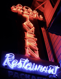 Neon sign of Olde Queens Tavern at night
