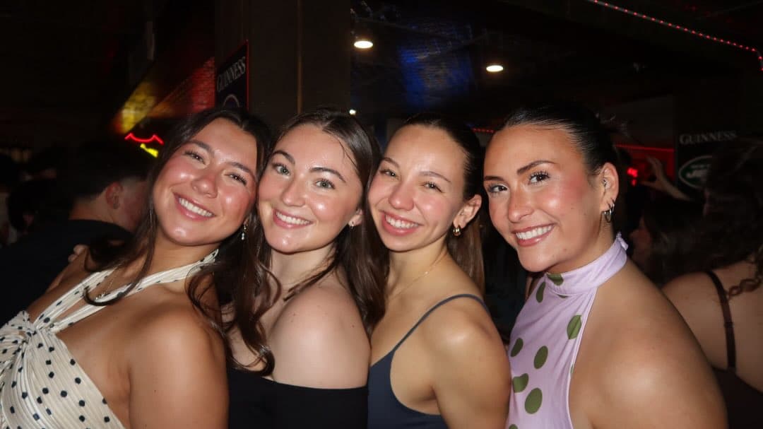Friends smiling at OQT